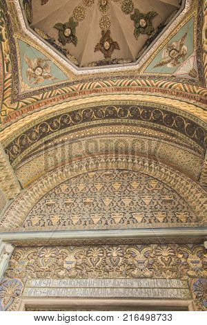 VAGHARSHAPAT ARMENIA - SEPTEMBER 17 2017: The decor of the main entrance to Etchmiadzin Mother Cathedral includes gilt relief Byzantine patterns