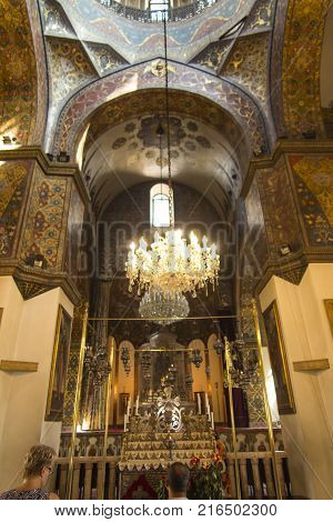VAGHARSHAPAT ARMENIA - SEPTEMBER 17 2017: Inside one of the oldest Etchmiadzin Cathedrals in the world. It has unique architectural style and design. Altar with chandelier
