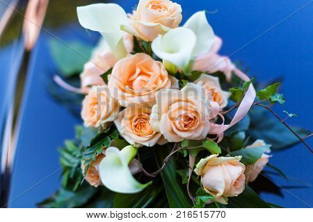 Macro view of the beautiful decorated bouquet of rose flowers on the wedding or marriage ceremony car with selective focus effect