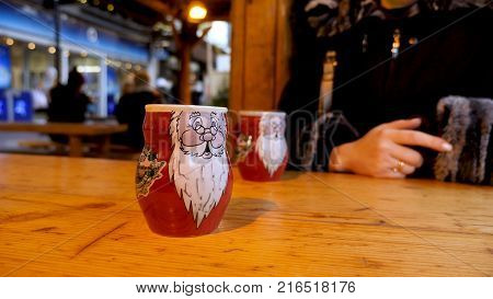 Steaming Cup of Hot Mulled Gluehwein at German Market in British Town.