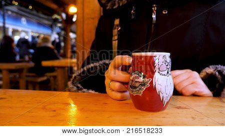 Steaming Cup of Hot Mulled Gluehwein at German Market in British Town.