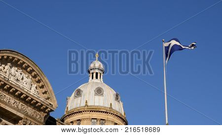 National flag of Scotland on a flagpole over Birmingham.