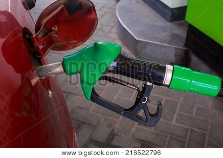 car fill with gasoline at a gas station