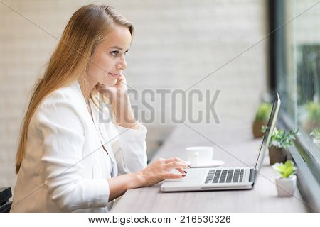 Tired And Unhappy Young Business Woman Using New Technology Gadget Connecting Distance Meeting. Business Freelance Coworking Space Luxurious Serviced Office For Rent Concept.