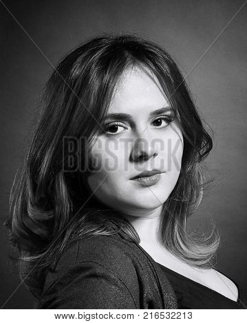 black and white closeup portrait of a young woman in a vintage style old film effect