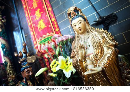 YAUMATEI, HONG KONG - JAN 10, 2014 - Statue of Guanyin, the Goddess of Mercy, at a Hong Kong temple
