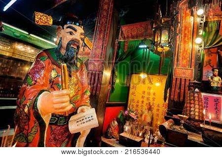 HONG KONG - JAN 10, 2014 - Statue of the Book Keeper at Tin Hau Temple, Yaumatei, Hong Kong.