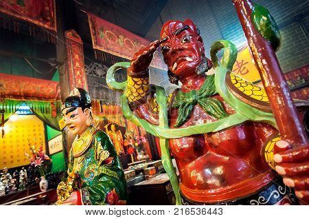 YAUMATEI, HONG KONG - JAN 10, 2014 - Demon guardian statue at Tin Hau Temple, Yaumatei, Hong Kong