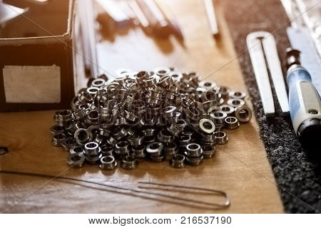 Pile of round screw-nuts. A lot of screw-nuts.