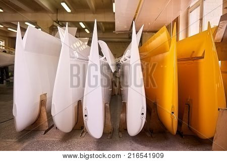 Aircraft wings and flaps. New airplane parts, workshop. Physics of the flight.