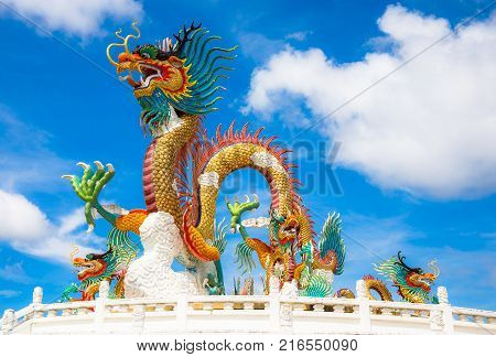 Nakornsawan, Thailand. - October 8, 2017 : Beautiful giant or big colorful dragon statue with blue sky at Nakornsawan Park, Thailand.