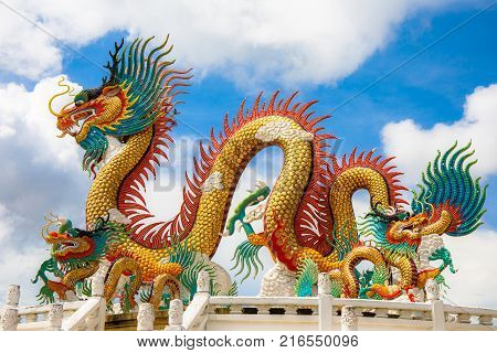Nakornsawan, Thailand. - October 8, 2017 : Beautiful giant or big colorful dragon statue with blue sky at Nakornsawan Park, Thailand.
