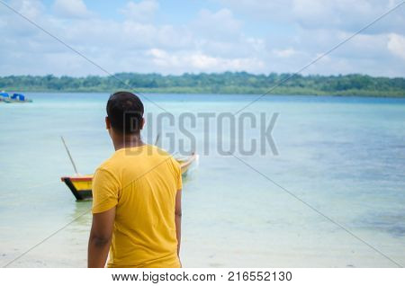 Man Standing and Looking at the Sea