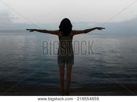 Girl With Open Arms doing Flying Gesture on a Beach