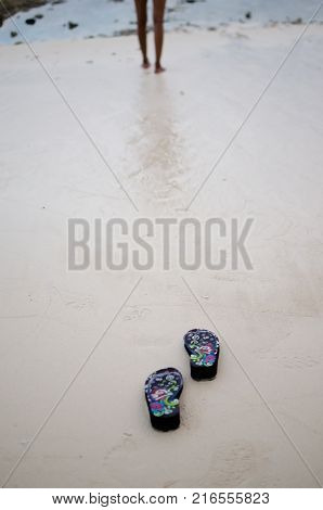Slippers or Flip Flops on a beach