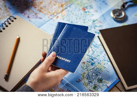 Travel Concept. Female Hand Marks The Spot On The Map. Top View