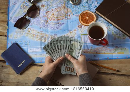 Travel Concept. Female Hand Marks The Spot On The Map. Top View