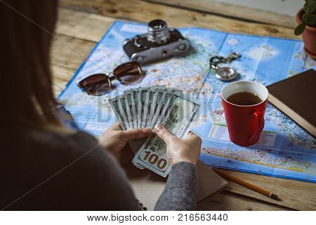 Travel Concept. Female Hand Marks The Spot On The Map. Top View
