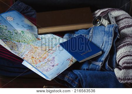 Travel Concept. Female Hand Marks The Spot On The Map. Top View