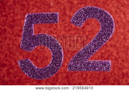 Number fifty-two purple over a red background. Anniversary. Horizontal