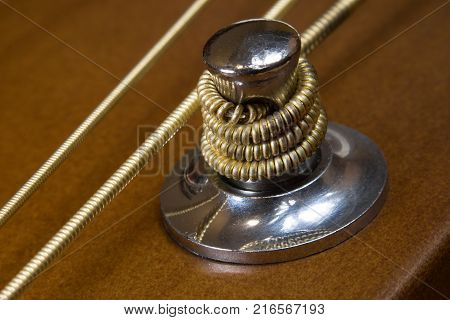 Detail of tuning head machine of acoustic six-strings guitar close-up