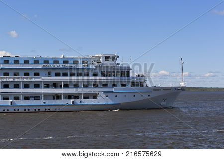 Goritsy, District of Kirillov, Vologda region, Russia - August 10, 2015: Passenger cruise ship Maxim Litvinov goes according the Sheksna River in Vologda Region