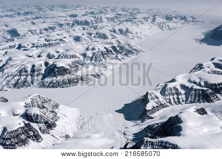 View at Greenland frozen mountains from above