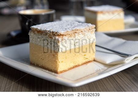 The original bled cream cake (cremeschnitte) on white plate