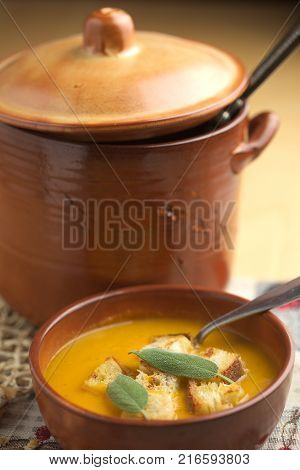 Pumpkin soup and leeks, with sage leaves.