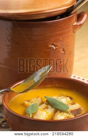 Pumpkin soup and leeks, with sage leaves.