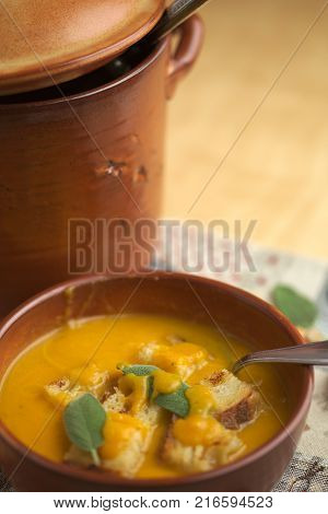 Pumpkin soup and leeks, with sage leaves.