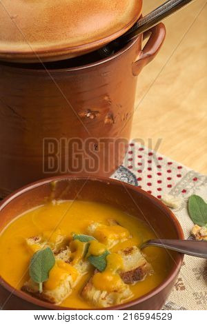 Pumpkin soup and leeks, with sage leaves.