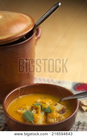 Pumpkin soup and leeks, with sage leaves.