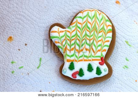 Homemade Christmas Gingerbread Decorated In The Form Of Mittens On The Background Of A White Napkin
