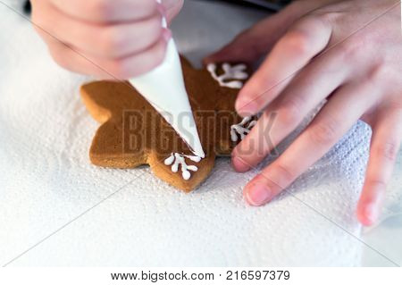 Homemade Christmas Gingerbread Decorated In The Form Of Mittens On The Background Of A White Napkin