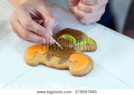Homemade Christmas Gingerbread Decorated In The Form Of Mittens On The Background Of A White Napkin