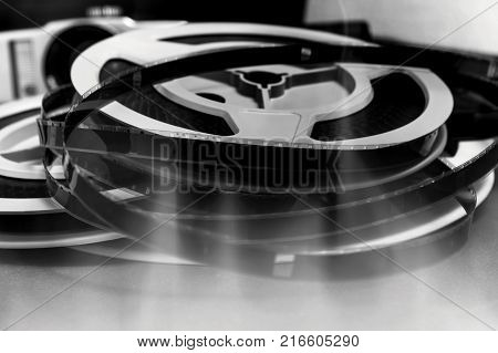 Still life of 8mm cine film reels with flame background.
