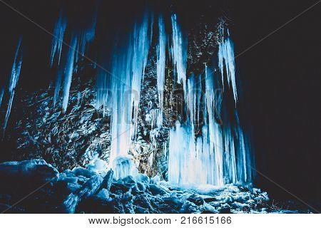 Icy on rocks at night. Beautiful winter landscape