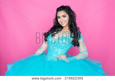 Hispanic teenage girl wearing a dress for a dance