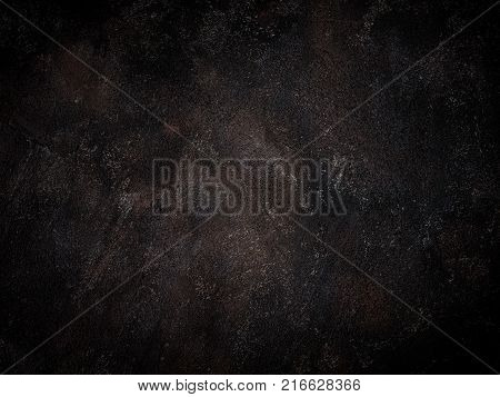 Black concrete wall. Dark cement grunge background with copy space