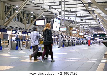 Vancouver, BC, Canada - October 13, 2017 : One side of passengers with luggage at international departure area inside YVR airport