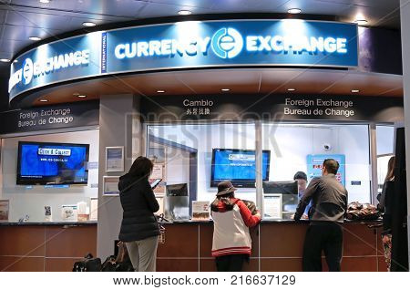 Vancouver, BC, Canada - October 13, 2017 : Motion of passengers at foreign currency exchange place inside YVR airport in Vancouver BC Canada