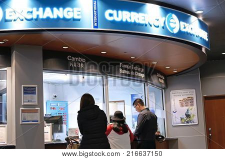 Vancouver, BC, Canada - October 13, 2017 : Motion of passengers at foreign currency exchange place inside YVR airport in Vancouver BC Canada