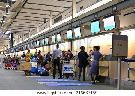 Vancouver, BC, Canada - October 13, 2017 : Motion of passengers with luggage at check in area inside YVR airport