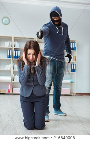 Criminal taking businesswoman as hostage in office
