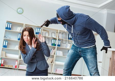 Criminal taking businesswoman as hostage in office