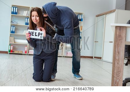 Criminal taking businesswoman as hostage in office