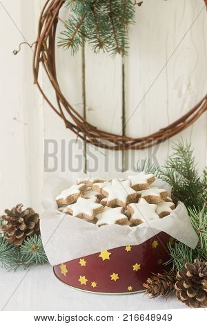 Cookies Cinnamon Star In A Tin Box On A Background Of Fir Branches And Cones.