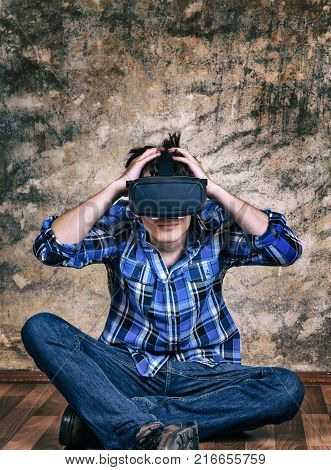 Toned Photo of Troubled Young Man in Virtual Reality Glasses