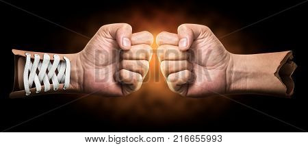 Creative of boxing hand on dark background with clipping path